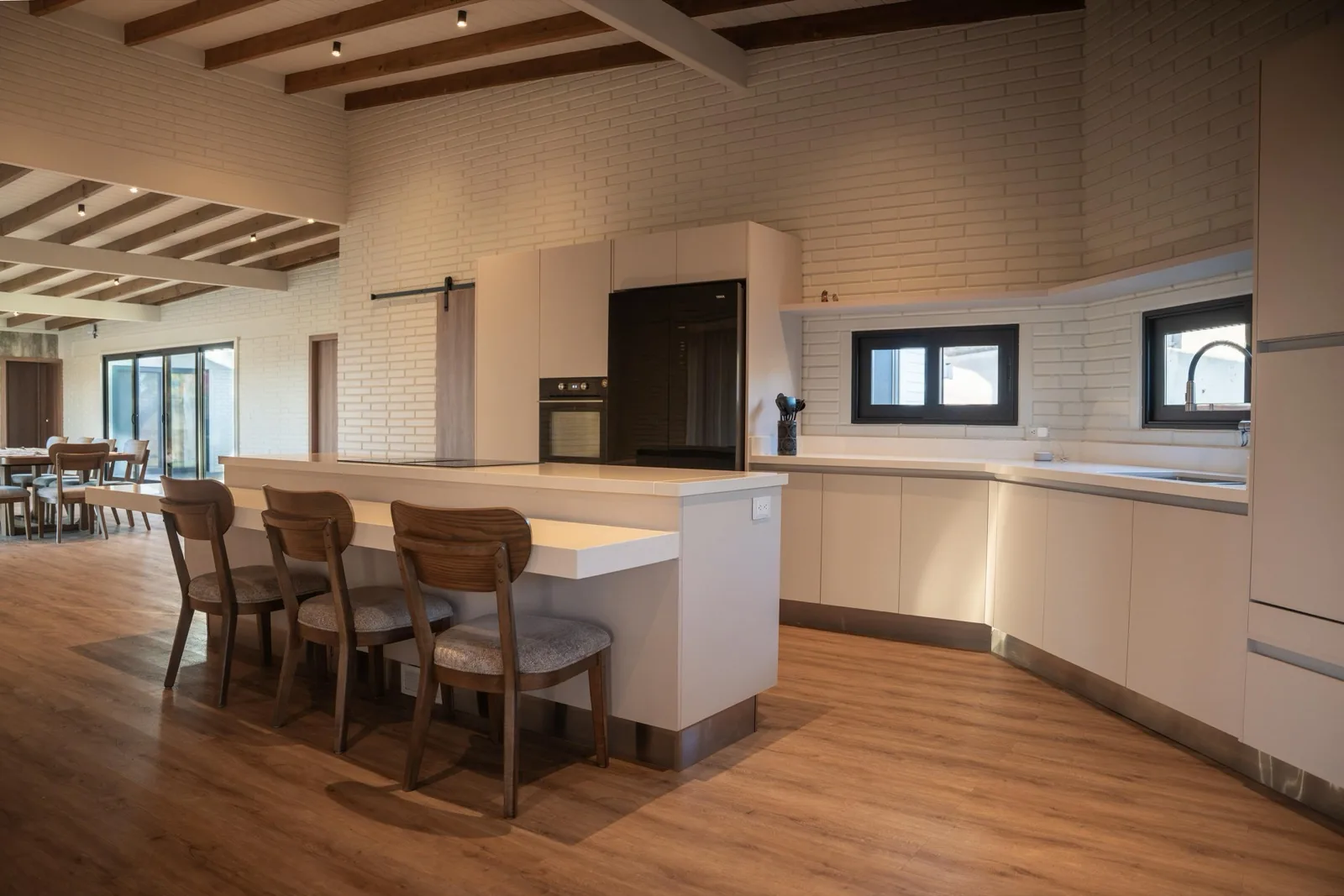 Open kitchen with peninsula and bar seating