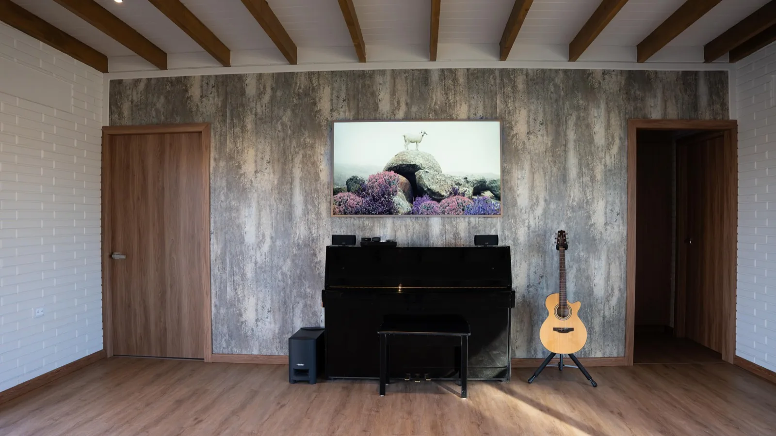 Living room with a textured feature wall and exposed beams