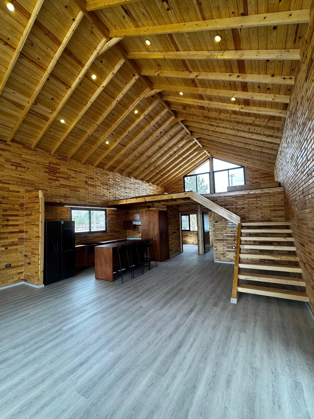 Natural wood cabin kitchen with dining table