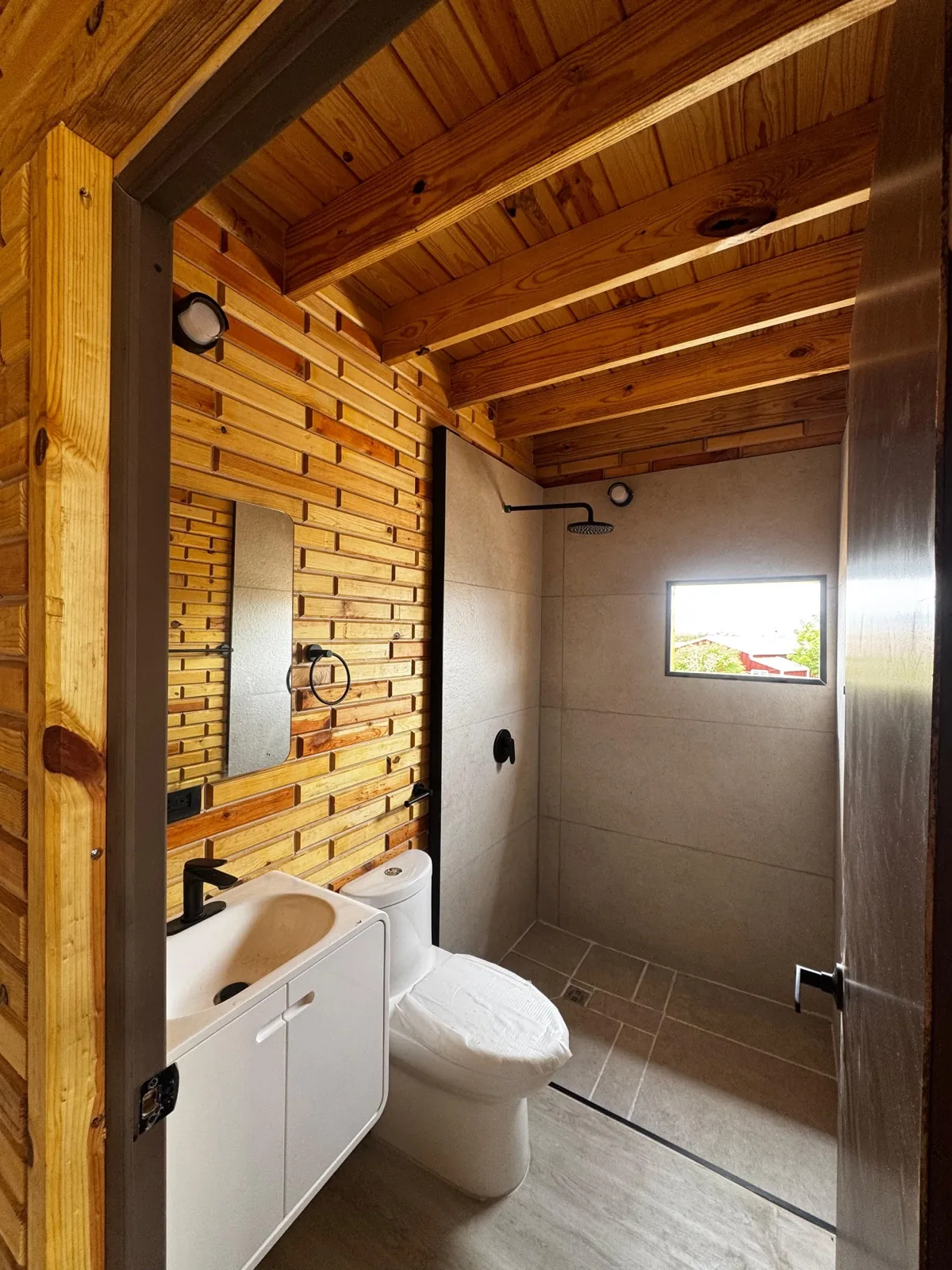 Natural wood interior with a loft and open staircase